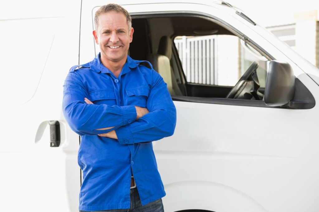 a man standing in front of a white van