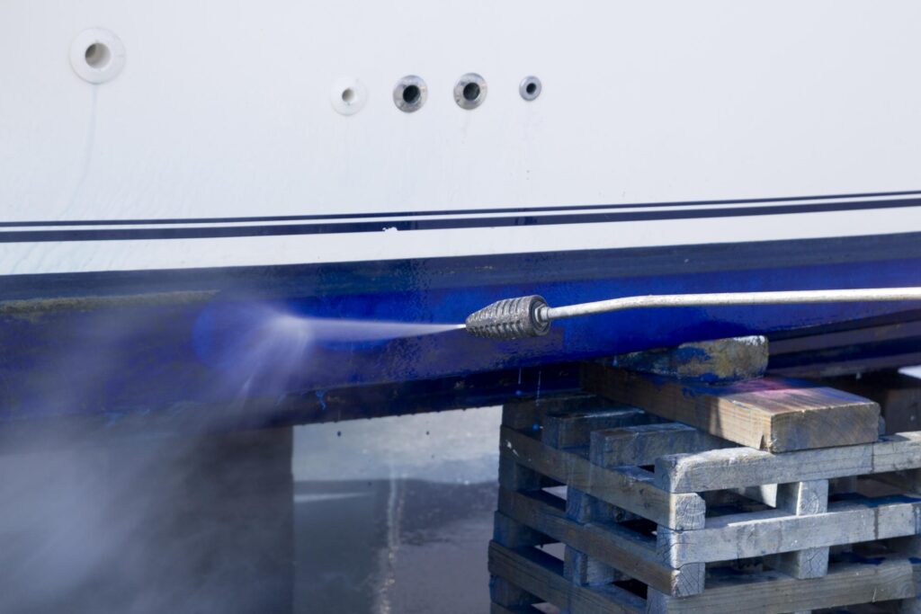 a boat being worked on by a machine